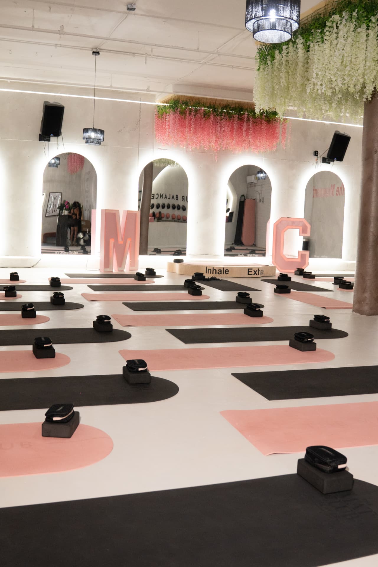 The Mat Club studio in Atlanta set with blush and black mats and gift bags for a brand activation